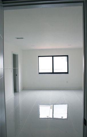a white bath tub sitting in a bathroom