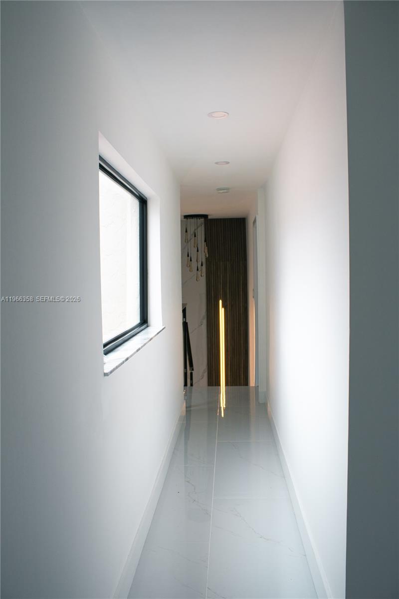 10433 Southwest 118th Court Miami, FL 33186 - Photo 20 of 32 a view of an empty room with a window