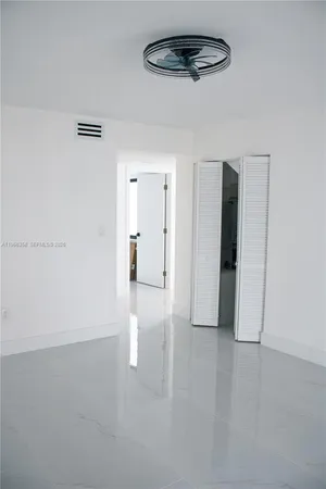 a bathroom with a sink a mirror and a shower