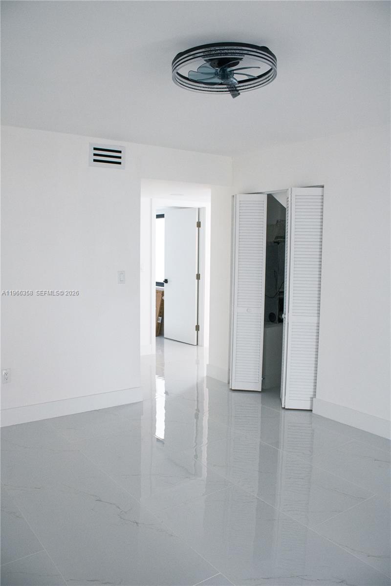 10433 Southwest 118th Court Miami, FL 33186 - Photo 22 of 32 wooden floor in an empty room