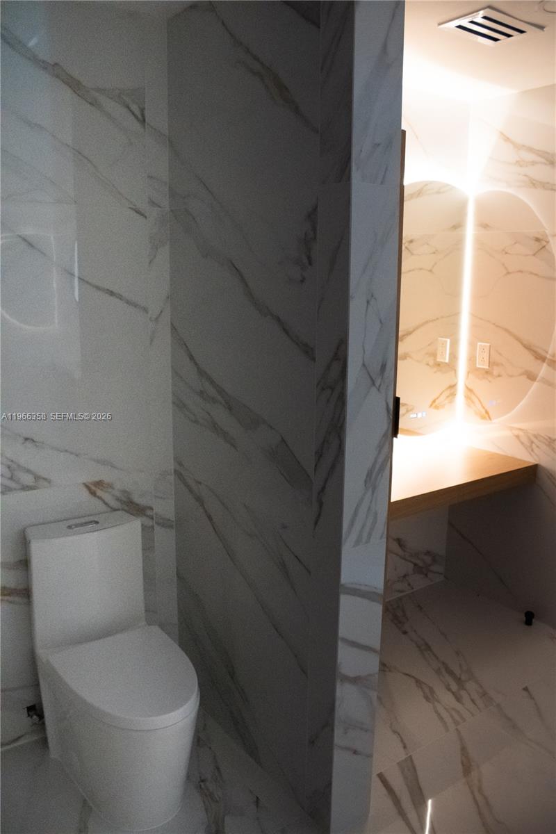 10433 Southwest 118th Court Miami, FL 33186 - Photo 29 of 32 a bathroom with a toilet and a shower