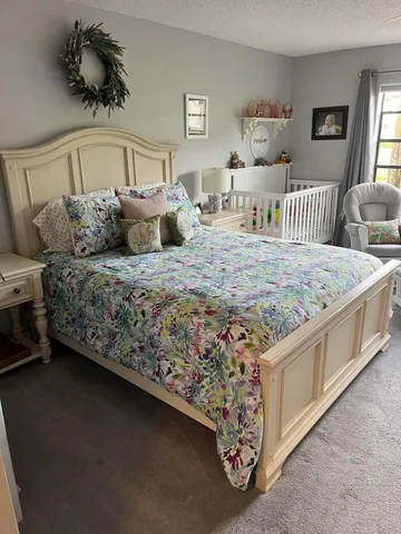 a bed room with a bed and a couch