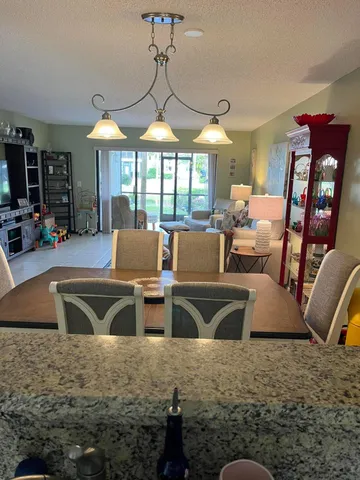 a view of a livingroom with furniture window and wooden floor