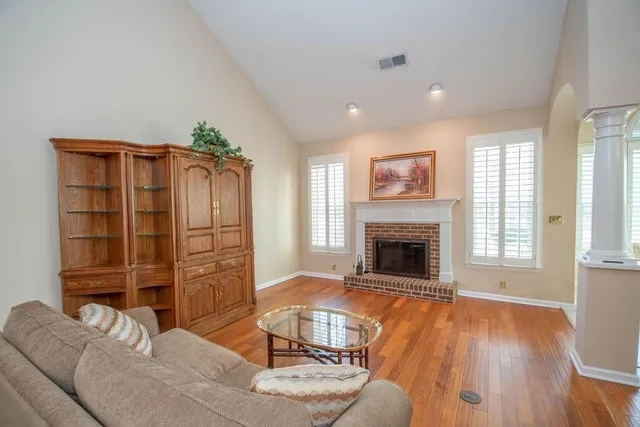 a living room with furniture windows and a fireplace