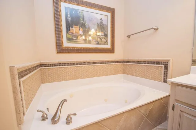a white bath tub sitting in a bathroom