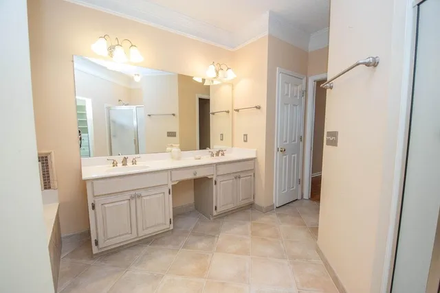 a bathroom with a double vanity sink mirror and double