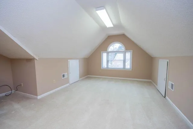 an empty room that has a window