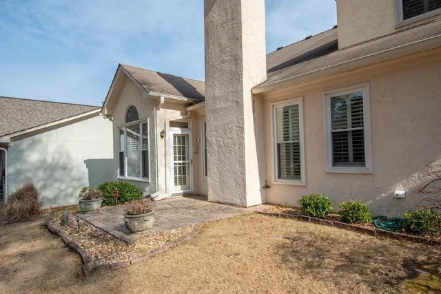 a front view of a house with garden