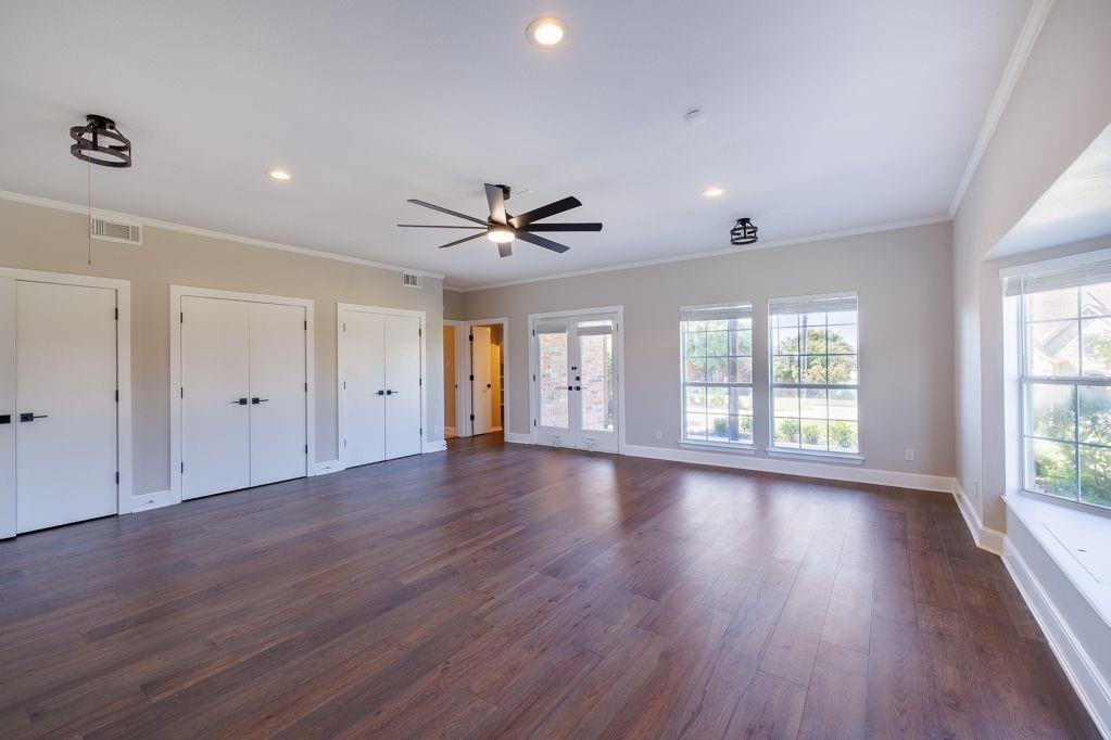 11507 Clipper Circle Frisco, TX 75036 - Photo 15 of 40 a view of an empty room with wooden floor and a window