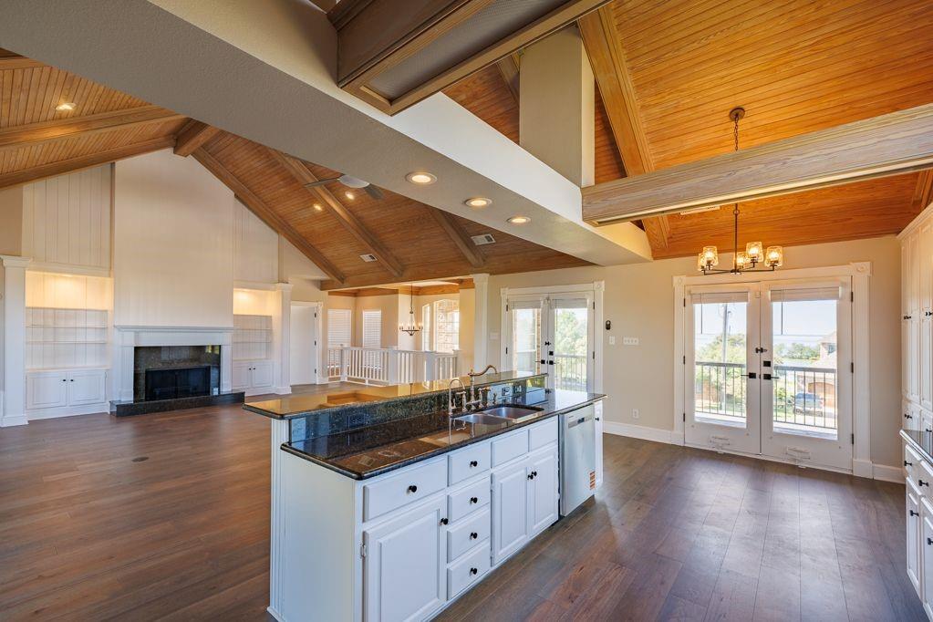 11507 Clipper Circle Frisco, TX 75036 - Photo 17 of 40 a kitchen with granite countertop a stove and cabinets