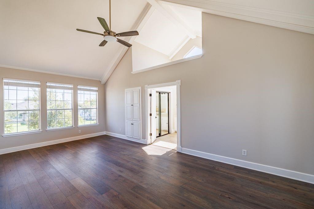 11507 Clipper Circle Frisco, TX 75036 - Photo 20 of 40 an empty room with wooden floor fan and windows