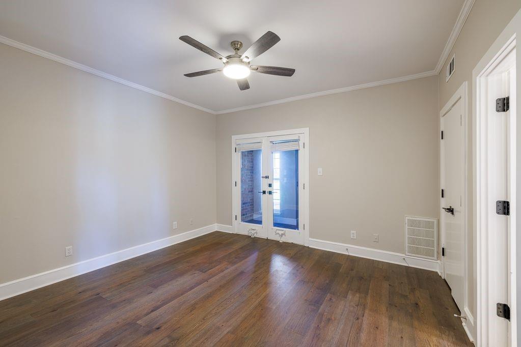 11507 Clipper Circle Frisco, TX 75036 - Photo 25 of 40 a view of an empty room with wooden floor and a window