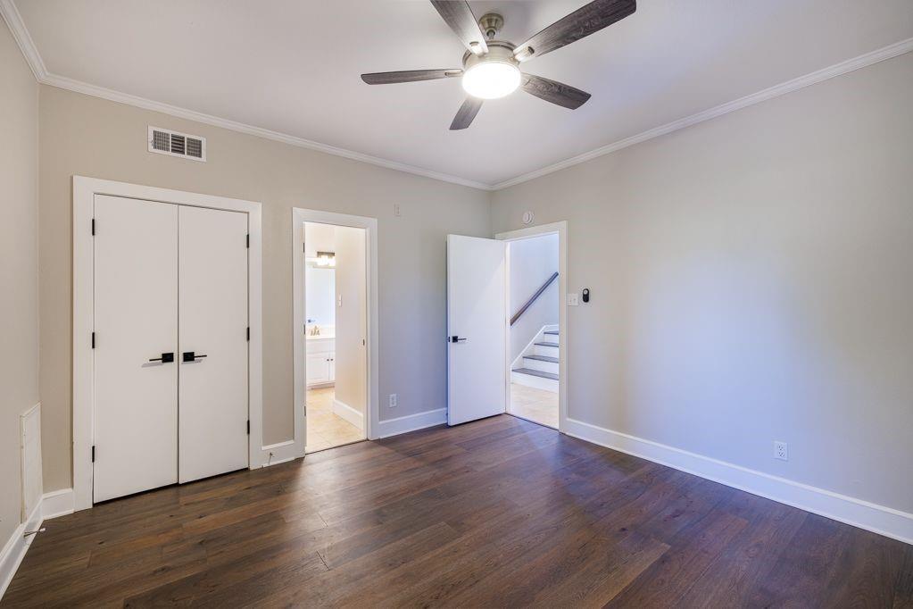 11507 Clipper Circle Frisco, TX 75036 - Photo 26 of 40 a view of an empty room with wooden floor and a ceiling fan