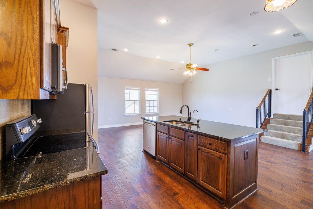 11507 Clipper Circle Frisco, TX 75036 - Photo 36 of 40 a kitchen with sink stove and refrigerator