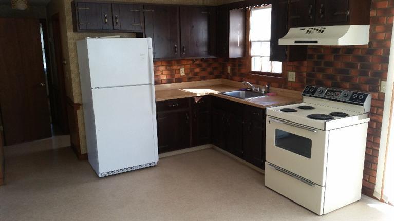 108 Clay Pond Road Bourne, MA 02532 - Photo 3 of 4 a kitchen with a refrigerator stove and sink