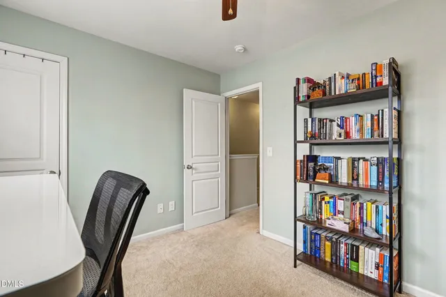a livingroom with a book shelf