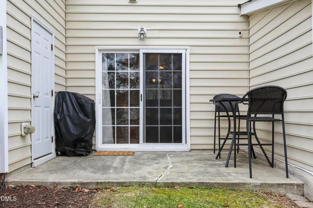 a view of a chairs and table in the patio