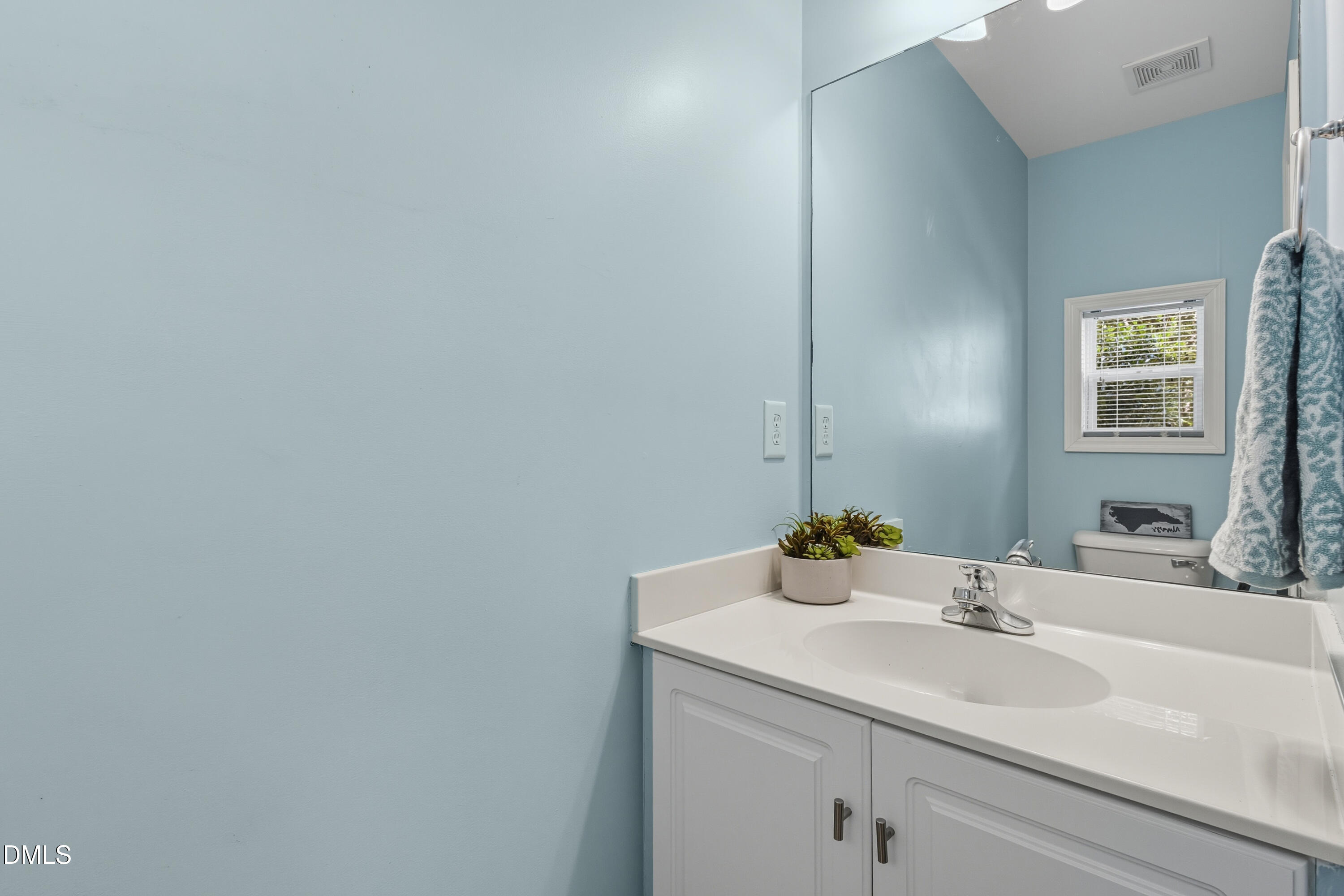 100 Raven Lane Carrboro, NC 27510 - Photo 13 of 31 a bathroom with a sink and a mirror