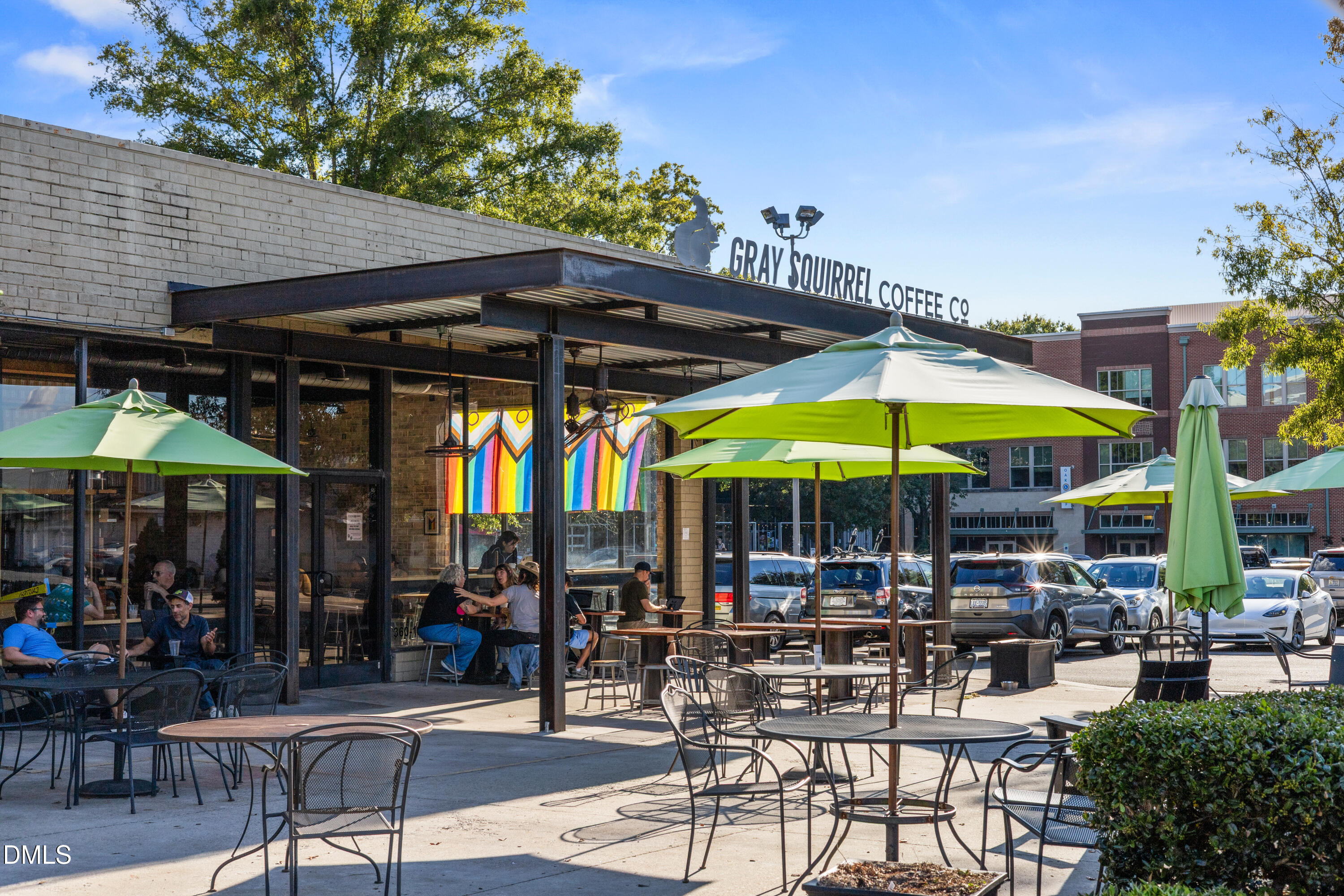 100 Raven Lane Carrboro, NC 27510 - Photo 31 of 31 a patio with a table and chairs under an umbrella