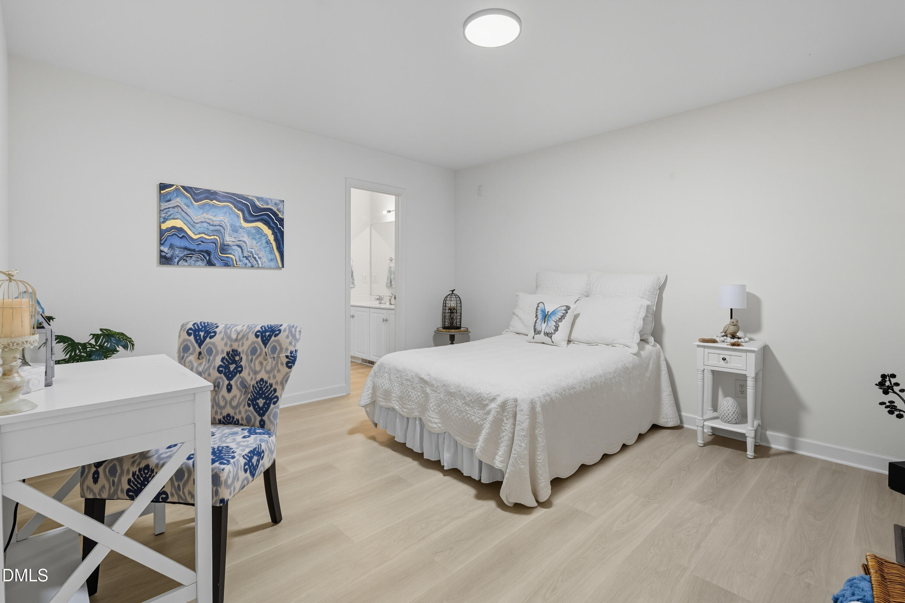 100 Raven Lane Carrboro, NC 27510 - Photo 9 of 31 a bedroom with a bed and a table