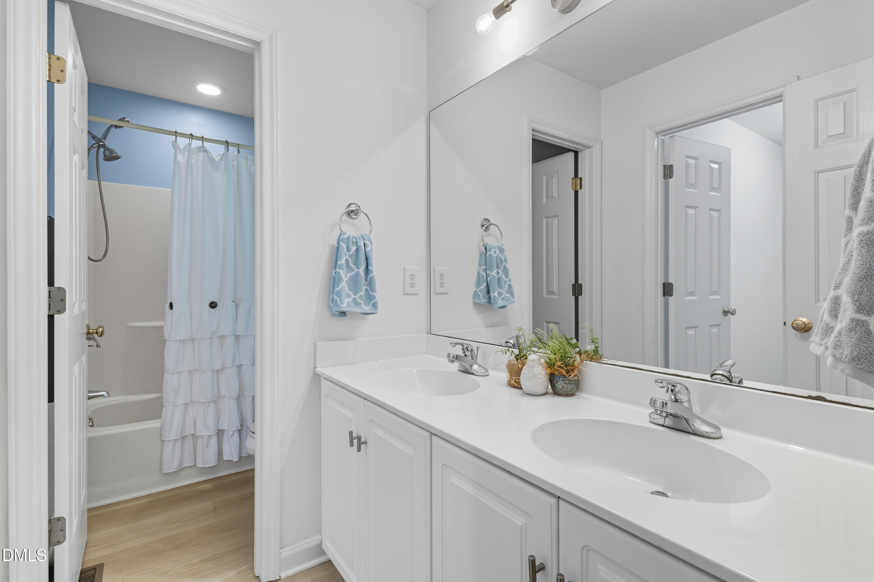 100 Raven Lane Carrboro, NC 27510 - Photo 10 of 31 a bathroom with double vanity sink and a mirror
