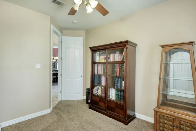 a view of a patio with couches table and chairs and potted plants