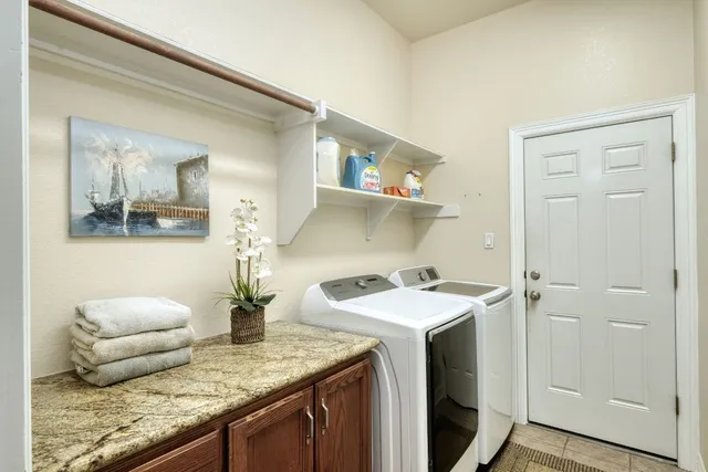 a view of a house with swimming pool and sitting area