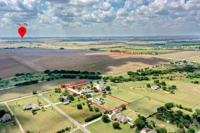 an aerial view of residential house with outdoor space
