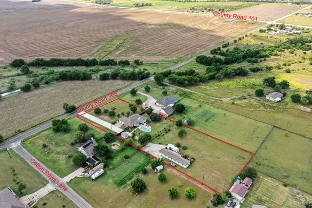a view of a house with yard and a garden