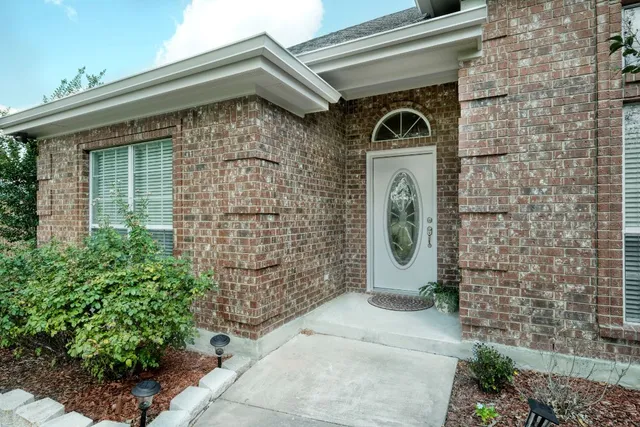 a living room with furniture and a large mirror
