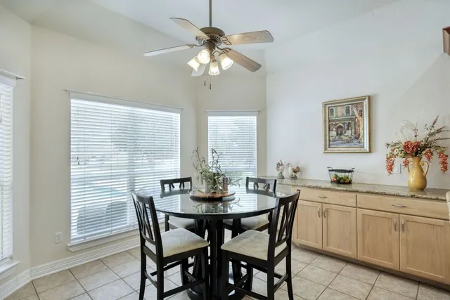 a kitchen with stainless steel appliances granite countertop a refrigerator sink and cabinets