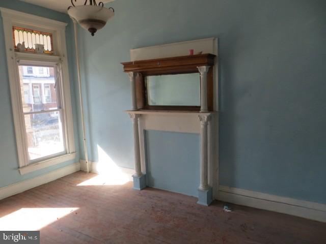 1607 Ruxton Avenue Baltimore, MD 21216 - Photo 2 of 5 a view of an empty room with a window