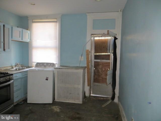 1607 Ruxton Avenue Baltimore, MD 21216 - Photo 5 of 5 a kitchen with a refrigerator and window