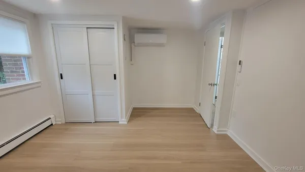 an empty room with wooden floor