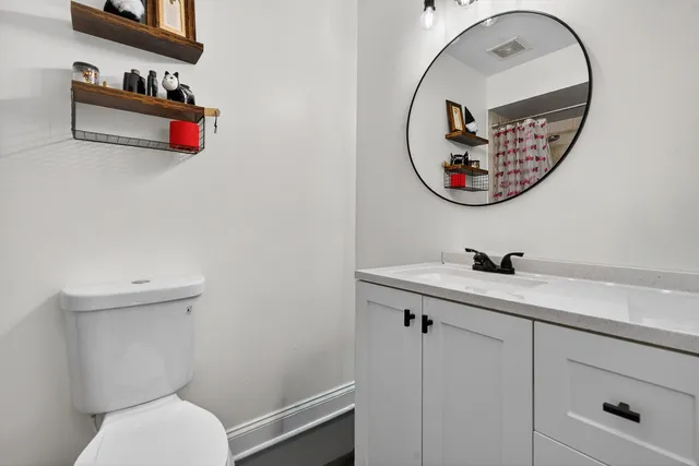 a bathroom with a toilet and a sink