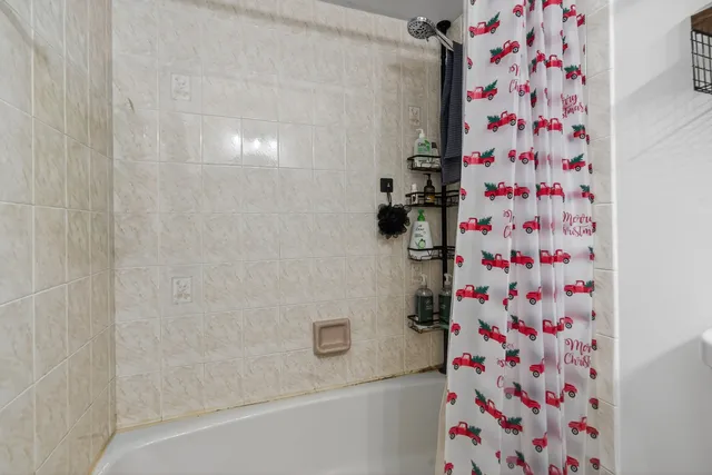 a bathroom with a shower curtain