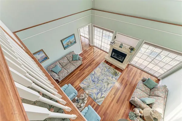 a kitchen with granite countertop white cabinets white appliances and sink