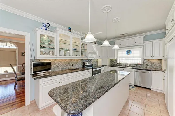 a kitchen with a table and chairs in it