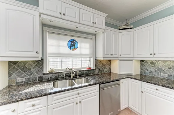 a view of empty room with window and wooden floor