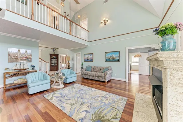a living room with furniture and a fireplace