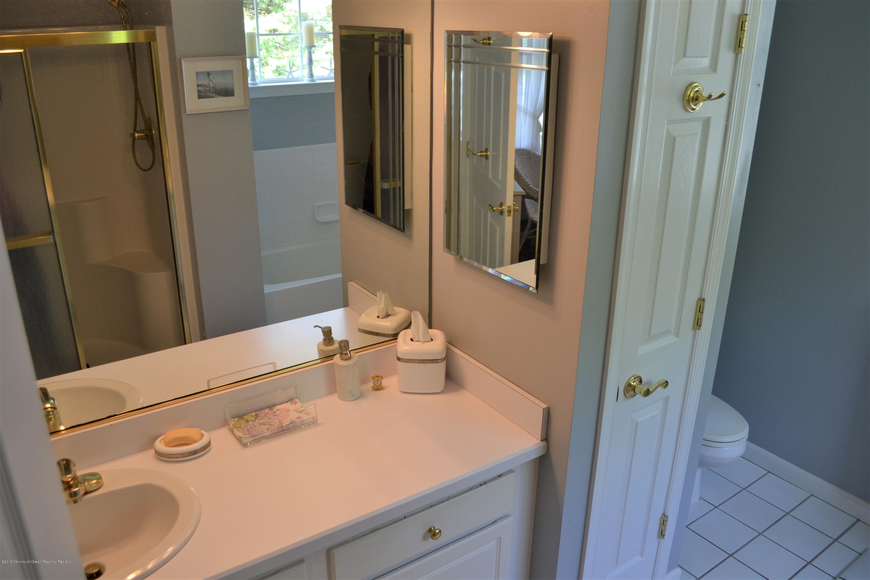 143 Wordsworth Road Brick, NJ 08724 - Photo 16 of 41 a bathroom with a sink a toilet and shower