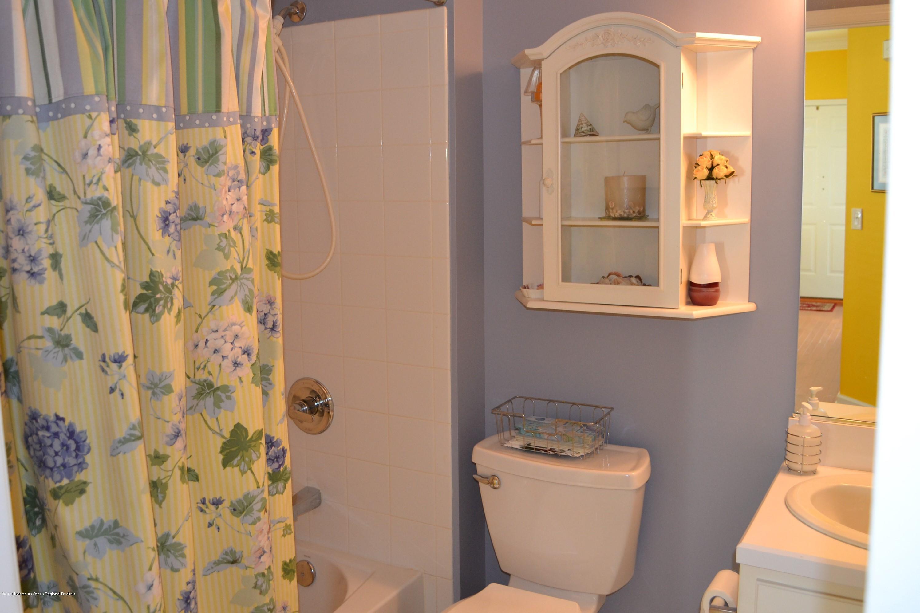 143 Wordsworth Road Brick, NJ 08724 - Photo 26 of 41 a bathroom with a toilet sink and mirror