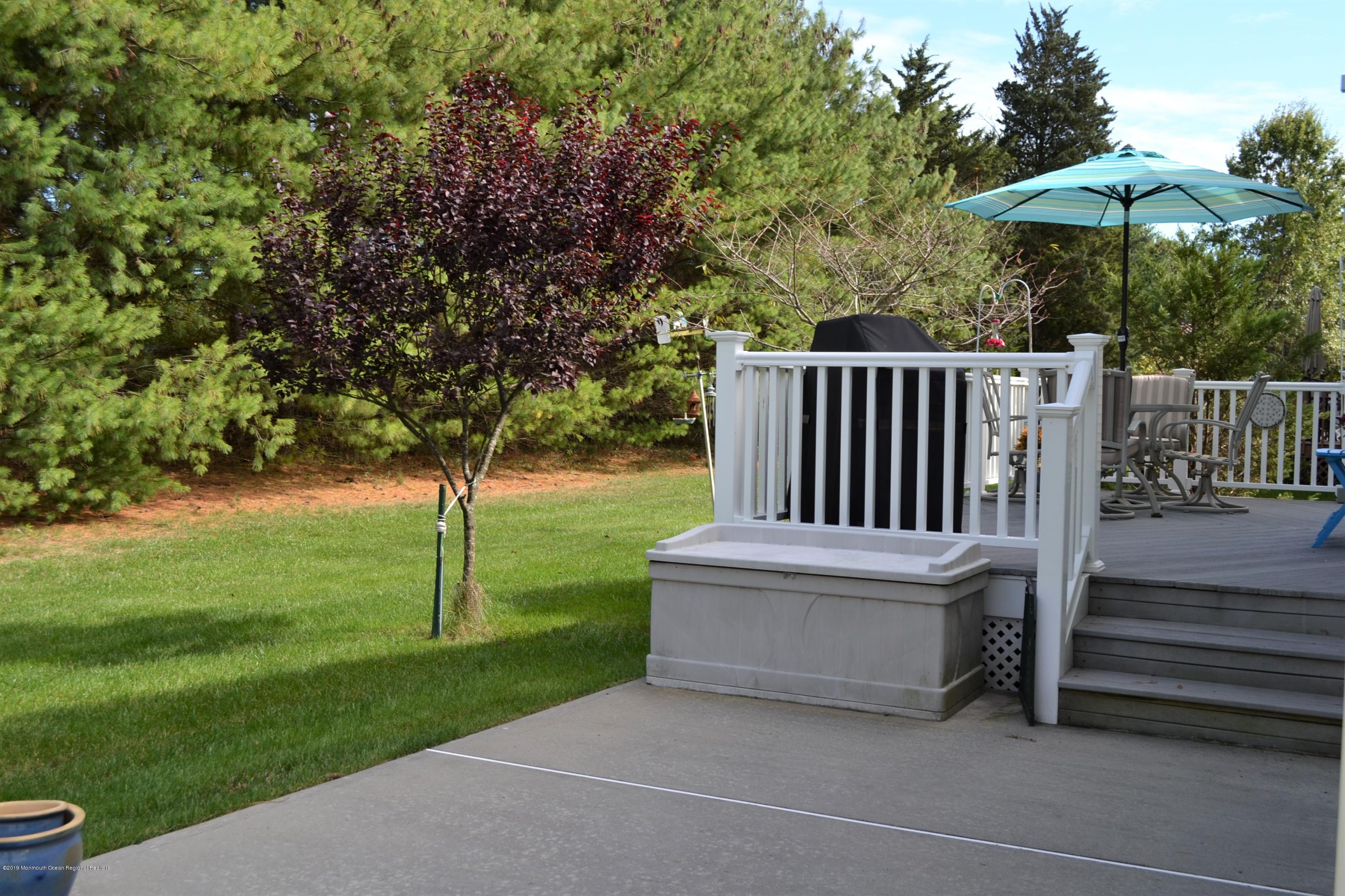 143 Wordsworth Road Brick, NJ 08724 - Photo 30 of 41 a view of a deck with a yard