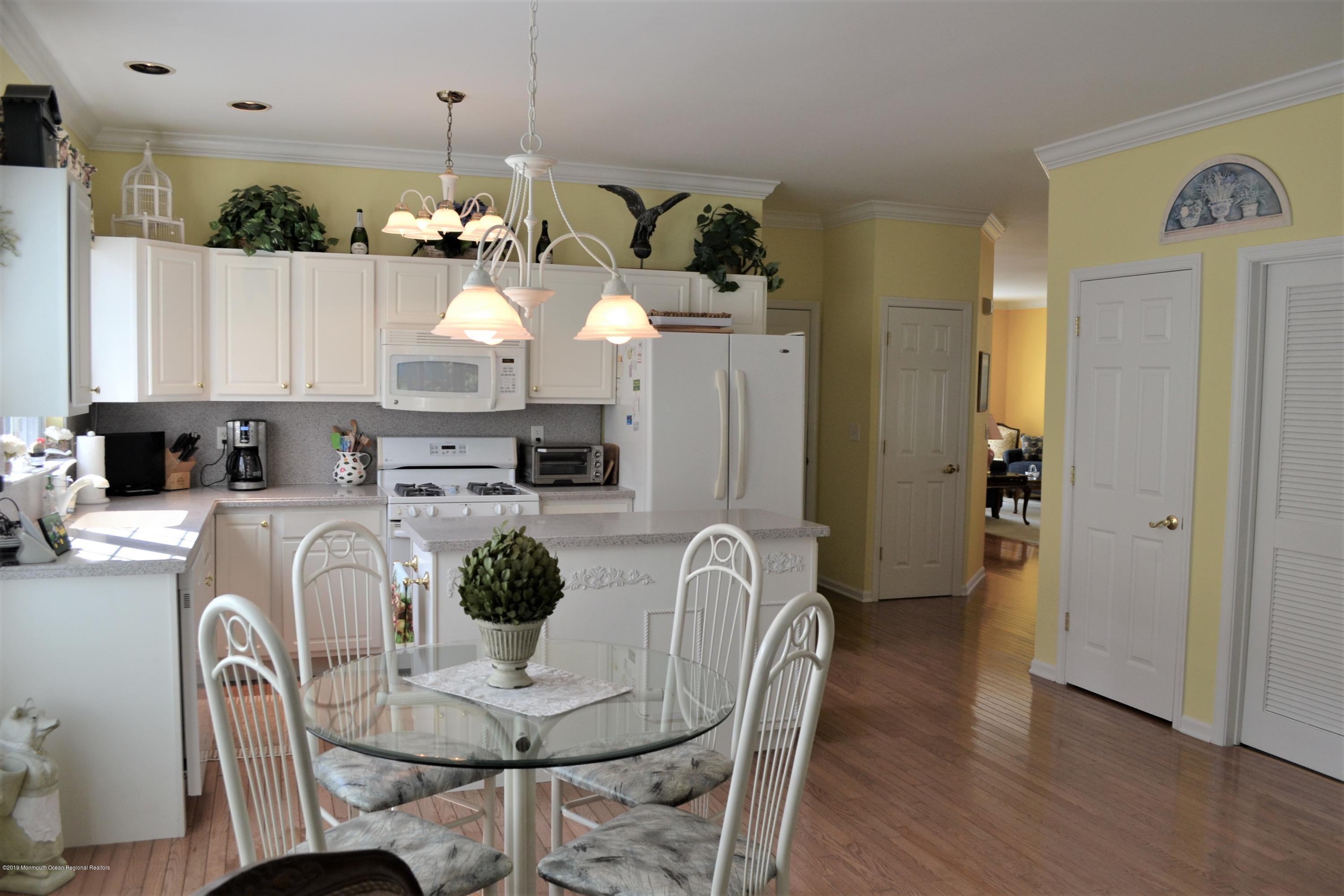143 Wordsworth Road Brick, NJ 08724 - Photo 8 of 41 a dining room with furniture a chandelier and wooden floor