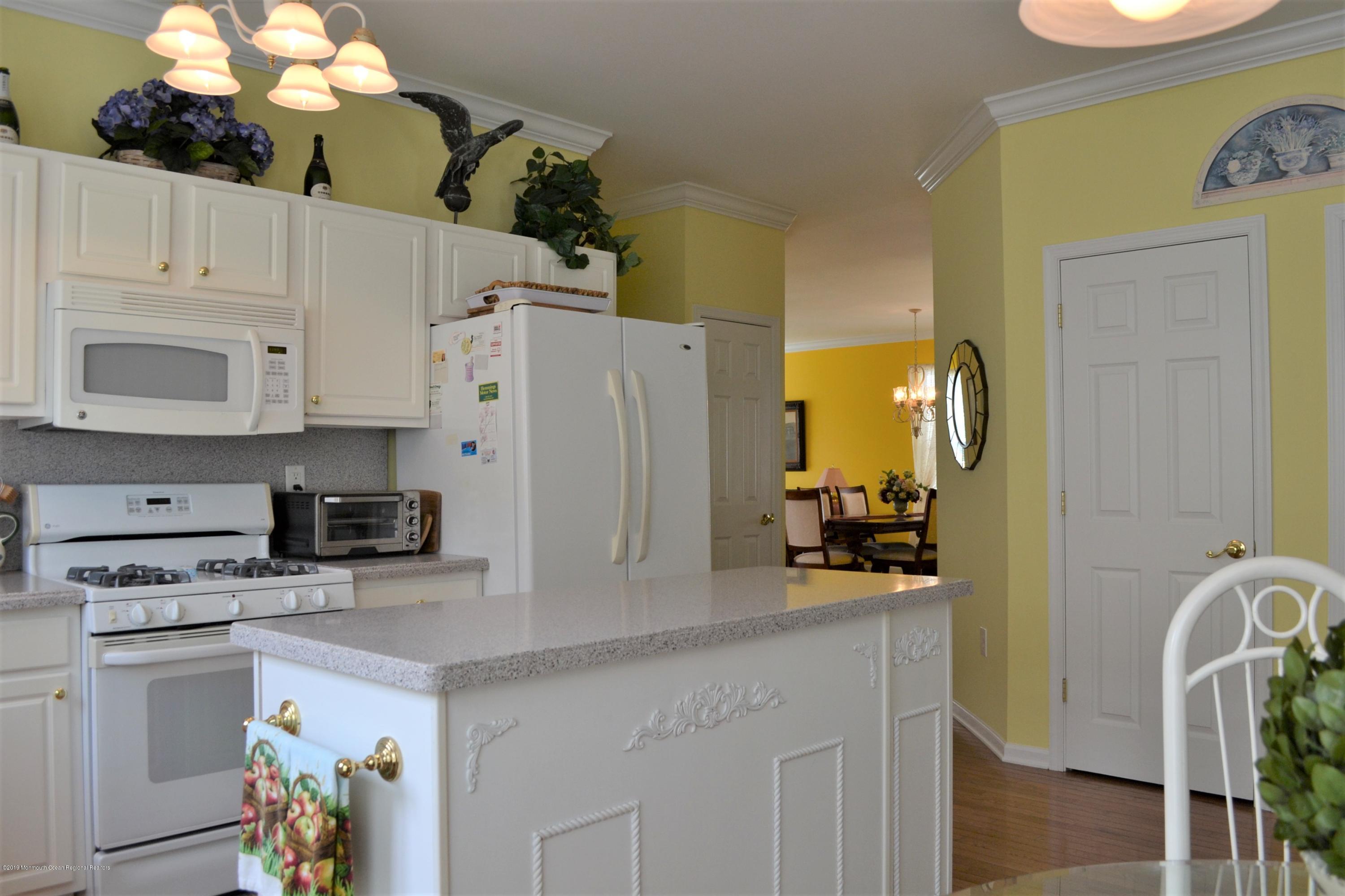 143 Wordsworth Road Brick, NJ 08724 - Photo 9 of 41 a kitchen with a white cabinets and white appliances