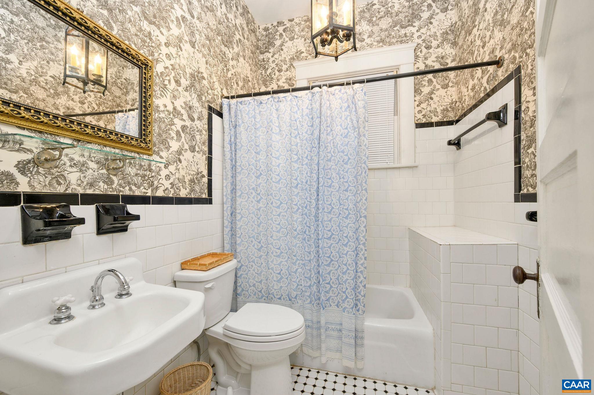 211 Robertson Avenue Charlottesville, VA 22903 - Photo 16 of 28 a bathroom with a sink toilet and shower