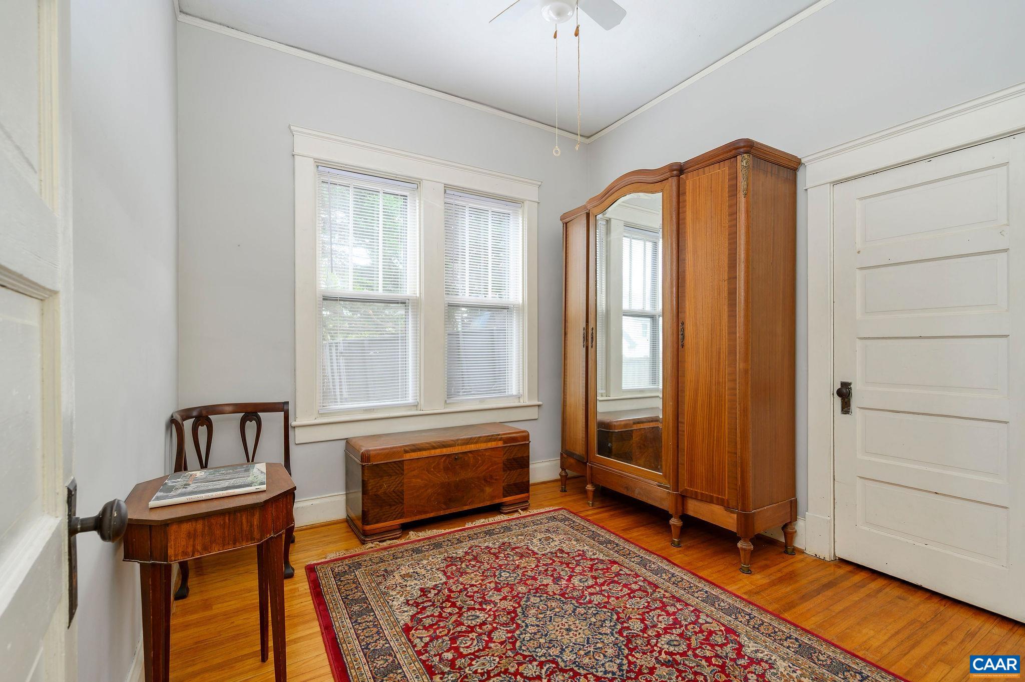 211 Robertson Avenue Charlottesville, VA 22903 - Photo 17 of 28 a spacious bedroom with a bed and a window