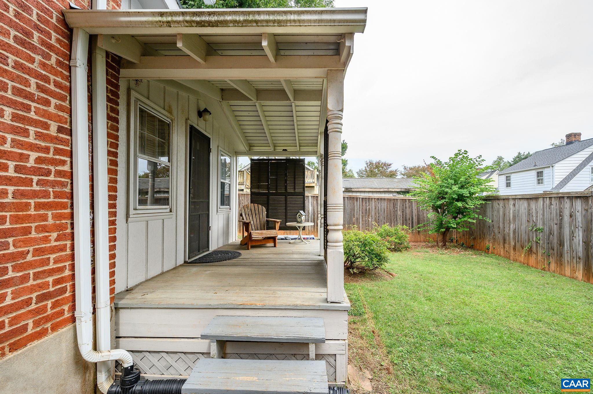 211 Robertson Avenue Charlottesville, VA 22903 - Photo 27 of 28 a view of a porch with a table and chairs and potted plants