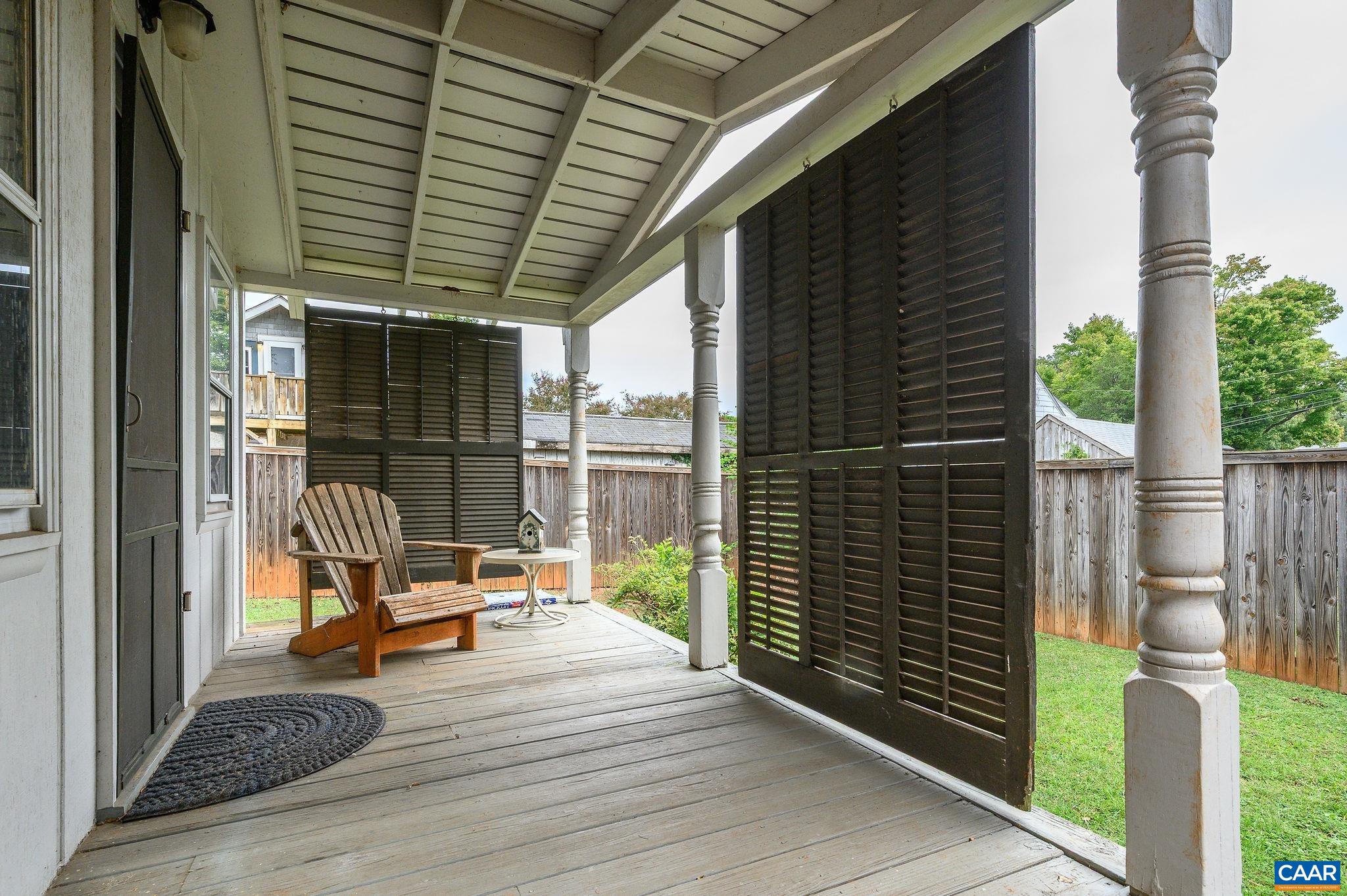 211 Robertson Avenue Charlottesville, VA 22903 - Photo 28 of 28 a chair and table in front of a house