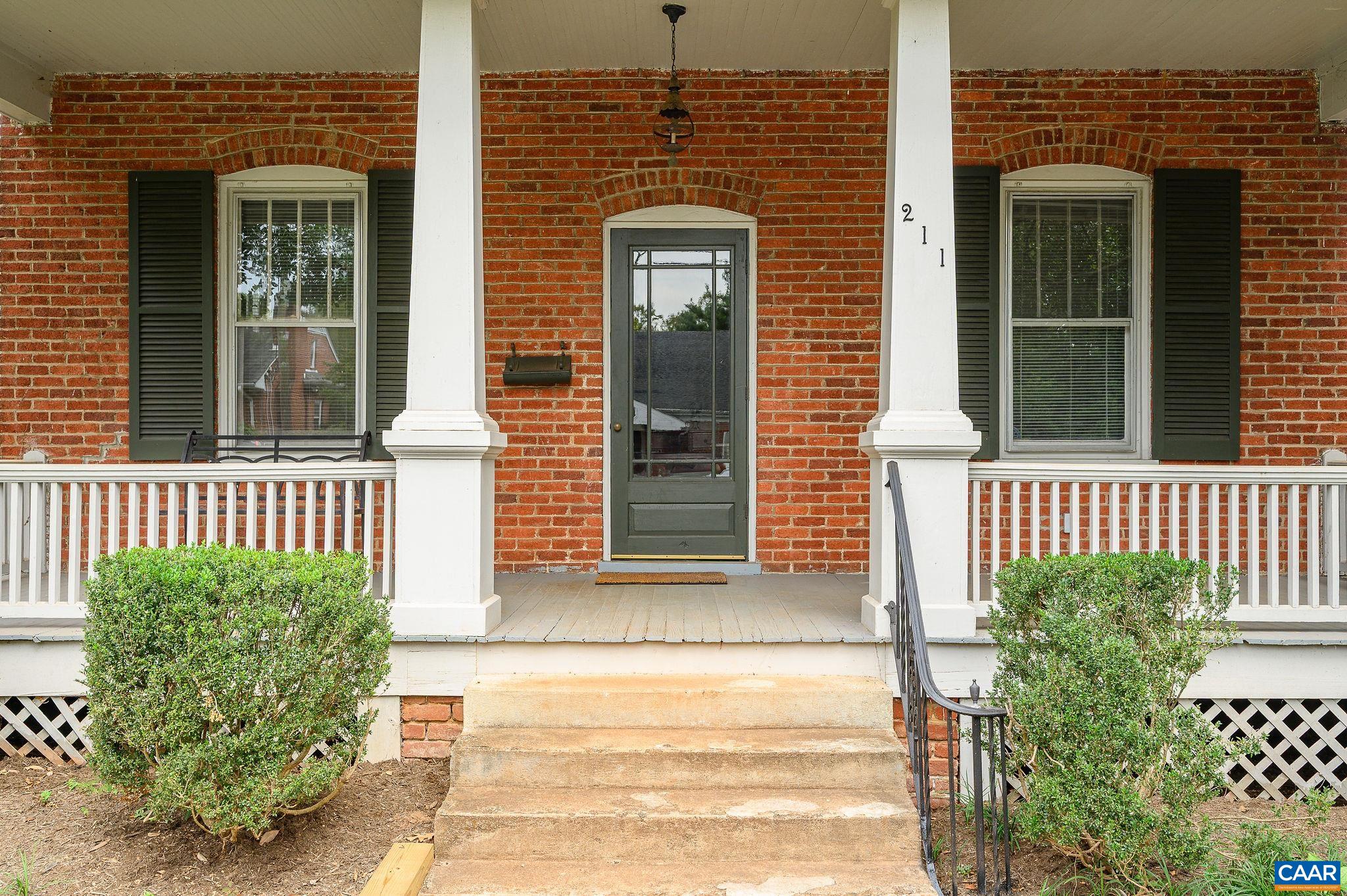 211 Robertson Avenue Charlottesville, VA 22903 - Photo 4 of 28 front view of a brick house with a large window